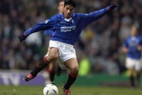 Mikel Arteta of Rangers runs with the ball during a Scottish Premier League match against Celtic in March 2003 