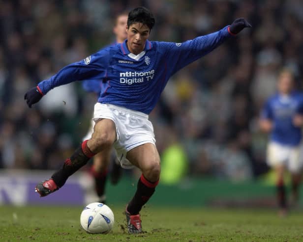 Mikel Arteta of Rangers runs with the ball during a Scottish Premier League match against Celtic in March 2003 
