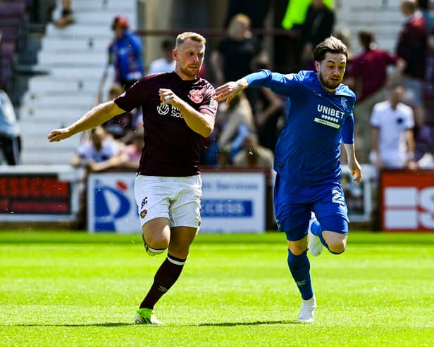 Hearts' Stephen Kingsley and Rangers' Scott Wright in action  at Tynecastle