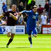 Hearts' Stephen Kingsley and Rangers' Scott Wright in action  at Tynecastle