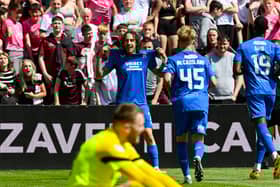 Rangers' Fabio Silva celebrates with team mates after scoring to make it 3-1 against Hearts