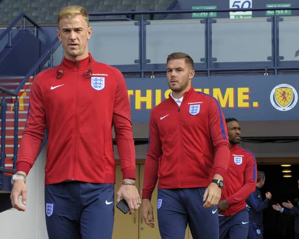 England's goalkeeper Joe Hart (L) and England's goalkeeper Jack Butland walk out to experience Hampden Park stadium