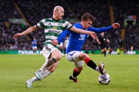 Ridvan Yilmaz of Rangers on the ball whilst under pressure from Daizen Maeda of Celtic 