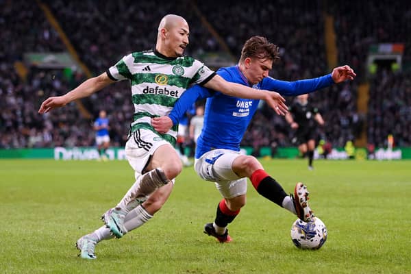 Ridvan Yilmaz of Rangers on the ball whilst under pressure from Daizen Maeda of Celtic 