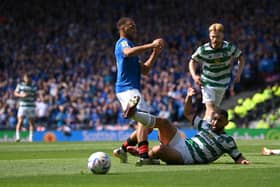 Celtic defender Cameron Carter-Vickers challenges Cyriel Dessers of Rangers in the penalty area 