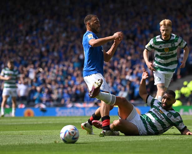 Celtic defender Cameron Carter-Vickers challenges Cyriel Dessers of Rangers in the penalty area 