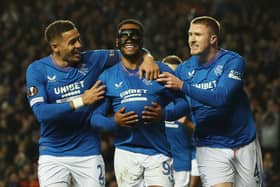 Danilo of Rangers (C) celebrates with teammates James Tavernier (L) and John Lundstram (R) after scoring against Sparta Prague