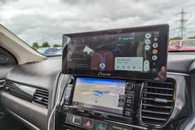 The Carpuride W103 sits on top of your dashboard, or on the windscreen, and gives you full access to Android Auto or Apple CarPlay