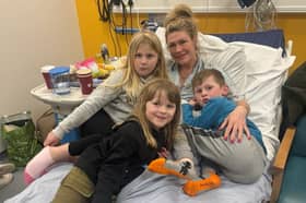 Lucy Woodhouse, 43, with her three children in hospital.