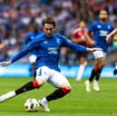 Rangers' Scott Wright has a shot during a pre-season friendly match against Manchester United