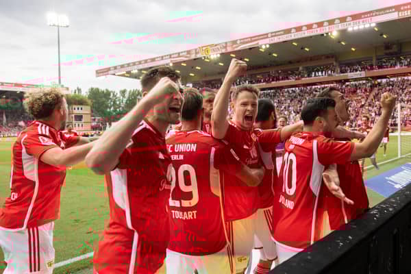 Janik Haberer of FC Union Berlin (obscured) celebrates scoring his team's second goal with teammates during a Bundesliga match against Freiburg lasts eason