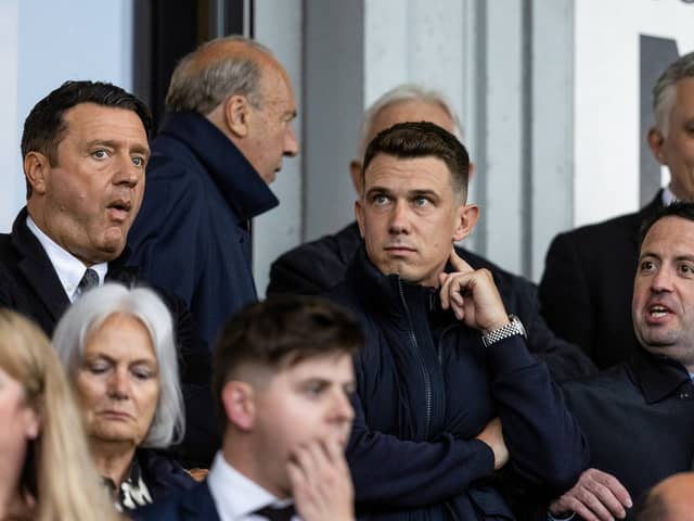 Scotland international Ryan Jack watches on from the stands  in Paisley