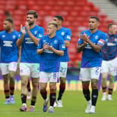 Rangers players walk around after their win against Motherwell