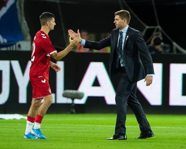Rangers' Jordan Jones (L) with manager Steven Gerrard