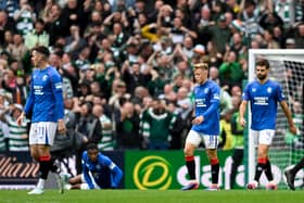 The Rangers players look on during the defeat at Parkhead.