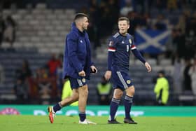 Scotland's John McGinn (L) has offered his take on Callum McGregor's decision to retire from international football