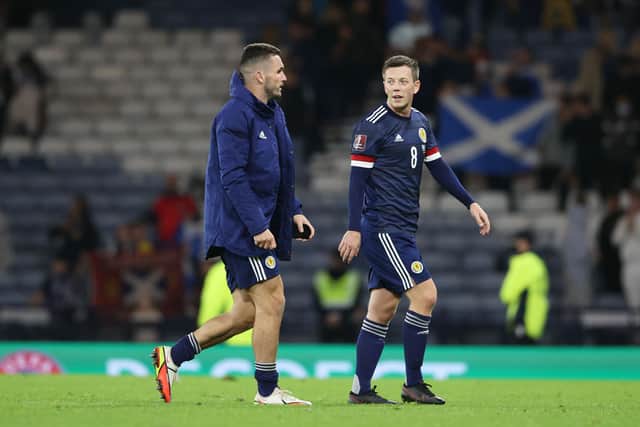 Scotland's John McGinn (L) has offered his take on Callum McGregor's decision to retire from international football