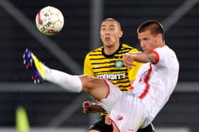 FC Sion's forward Aleksandar Prijovic (R) challenges Celtic FC's German defender Cha Du-Ri