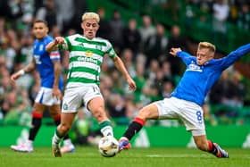 Celtic's Luke McCowan and Rangers midfielder Connor Barron. Cr: SNS Group.