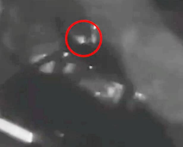 CCTV captures two men creeping up on the parked car 