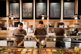 Tom McDermott and team behind the salad bar at Sprigg