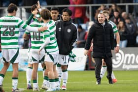 Brendan Rodgers watches his team celebrate the win over County.