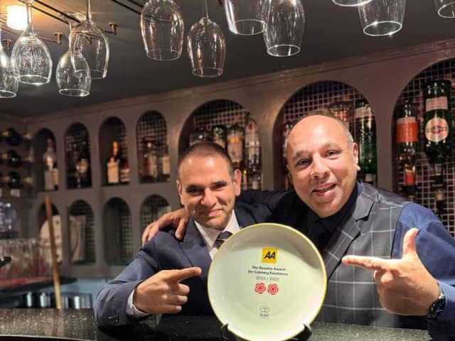 The team from Shish Mahal pose with their AA rosette