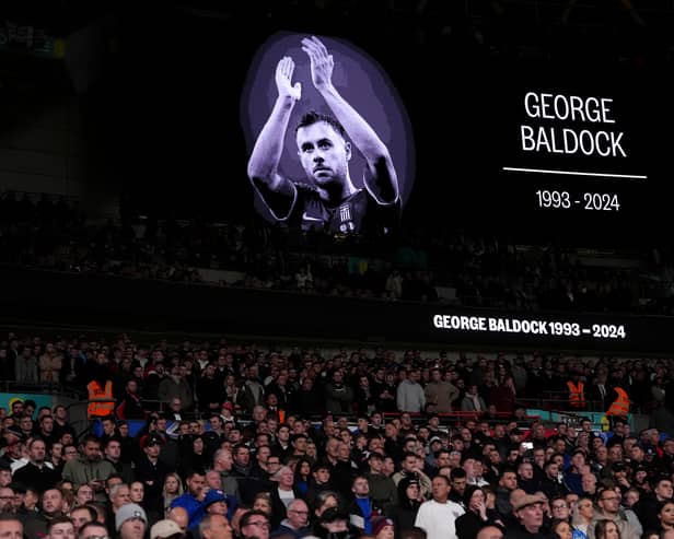A tribute to George Baldock on the big screen ahead of the UEFA Nations League Group B2 match at Wembley Stadium, London.   Adam Davy/PA Wire.
