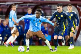 Belgium's Mandela Keita holds off Scotland's Lennon Miller at Tynecastle.