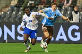 France midfielder Manu Kone fights for the ball with Belgium midfielder Arne Engels during a Nations League clash at the King Baudouin Stadium in Brussels