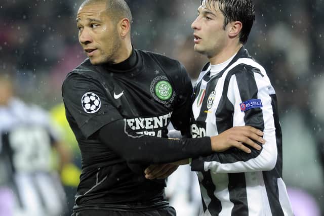 Kelvin Wilson (L) of Celtic and Federico Peluso of Juventus tussle during the Champions League round of 16 second leg match in 2013