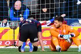 Rangers defender John Souttar (left) and goalkeeper Jack Butland are left on the deck after Kilmarnock's Marley Watkins scores an 88th minute winner. (Photo by Rob Casey / SNS Group)