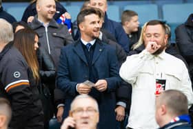 Former Rangers captain Barry Ferguson takes his seat ahead of the game.