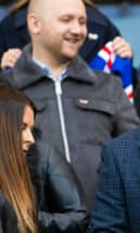 Former Rangers captain Barry Ferguson takes his seat ahead of the game.