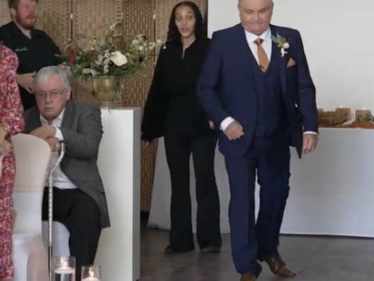 Neil Crossley walks down the aisle at his daughter's wedding, forgetting to take her with him.