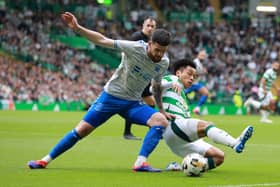 Reo Hatate of Celtic and Liam Donnelly of Kilmarnock 