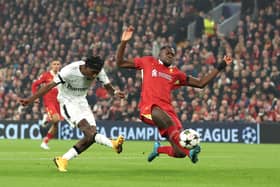 Jeremie Frimpong of Bayer 04 Leverkusen scores a goal whilst under pressure from Ibrahima Konate of Liverpool which is later is disallowed due to handball 