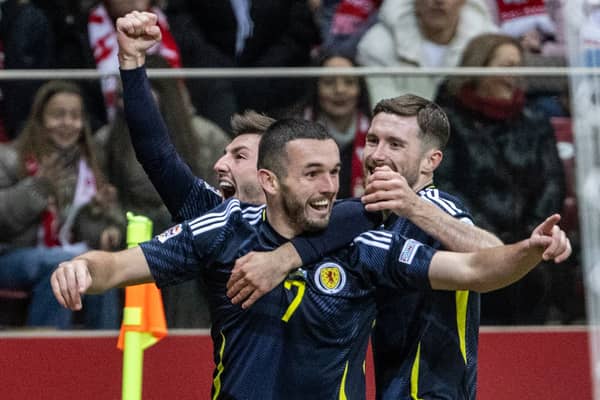 John McGinn celebrates scoring Scotland's opener against Poland in Warsaw