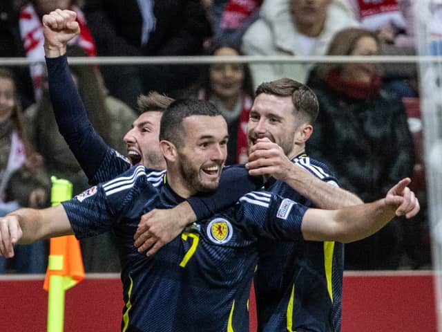 John McGinn celebrates scoring Scotland's opener against Poland in Warsaw