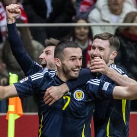 John McGinn celebrates scoring Scotland's opener against Poland in Warsaw