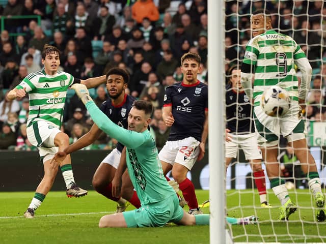 Paulo Bernardo of Celtic scores his team's third goal against Ross County