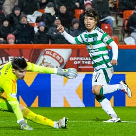Celtic's Reo Hatate scores to seal a 1-0 win over Aberdeen at Pittodrie Stadium. (Photo by Ross MacDonald / SNS Group)