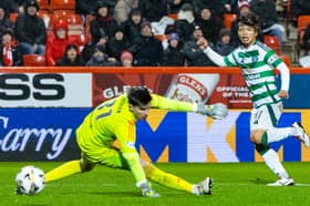 Celtic's Reo Hatate scores to seal a 1-0 win over Aberdeen at Pittodrie Stadium. (Photo by Ross MacDonald / SNS Group)
