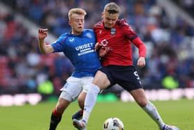 Connor Barron of Rangers vies with Ronan Hale of Ross County during the side's previous meeting at Hampden Park in August