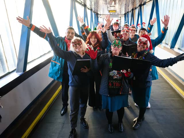 Carol singers take over Uk train station to spread important message