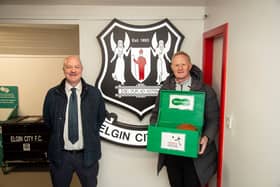 Specsavers Elgin store partner Peter Taylor and Colin Hendry.