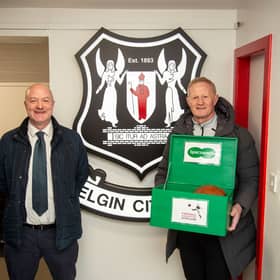 Specsavers Elgin store partner Peter Taylor and Colin Hendry.