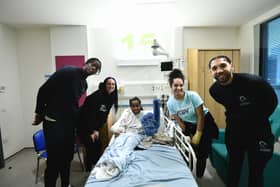 The Caledonia Gladiators men’s and women’s team spending time with a young patient at Glasgow Children’s Hospital