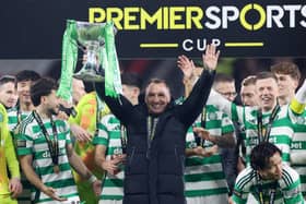 Brendan Rodgers, manager of Celtic, celebrates with the Premier Sports Cup trophy