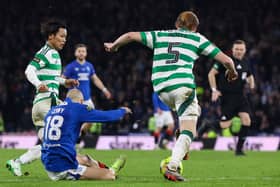 Celtic's Liam Scales (R) pulls down Rangers' Vaclav Cerny at the edge of the penalty box during the Premier Sports Cup final.